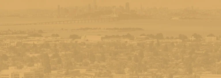 A city with a bridge and trees