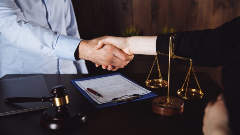 client shakes hands with lawyer